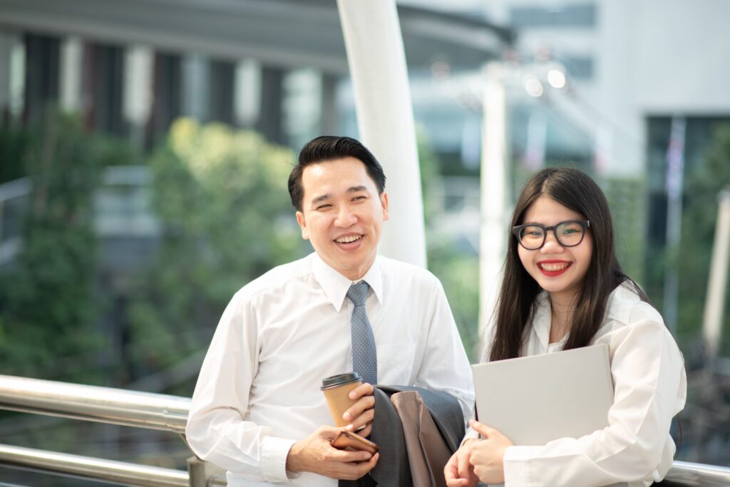 Business professionals representing SFO principals and advisers discussing long-term residency planning in Singapore.