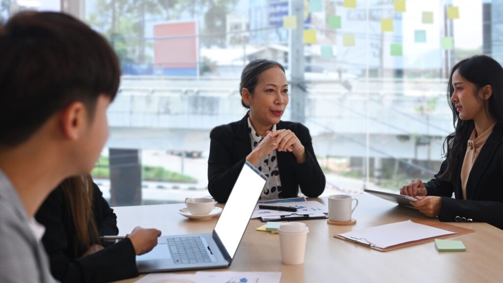 Family office professionals discussing investment planning and compliance requirements in Singapore.